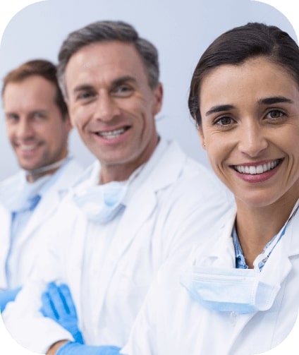 Three smiling dentists in Castleton Vermont dental office