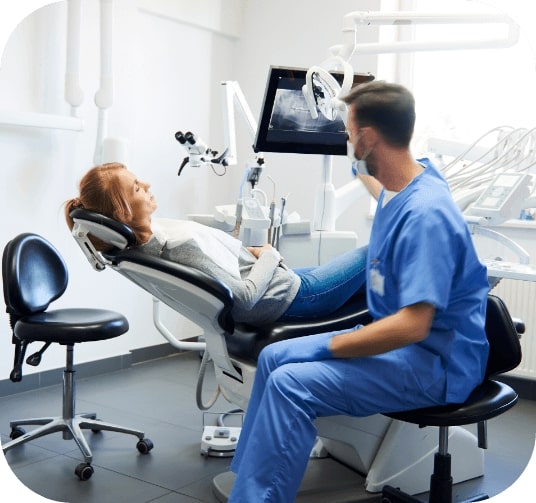 Dentist talking to dental patient during emergency dentistry visit