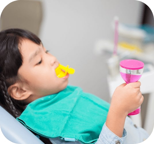 Child receiving fluoride treatment