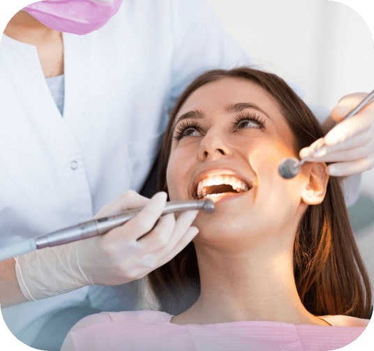 Woman receiving dental emergency treatment