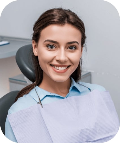 Woman sharing flawless smile after visiting the cosmetic dentist in Castleton Vermont
