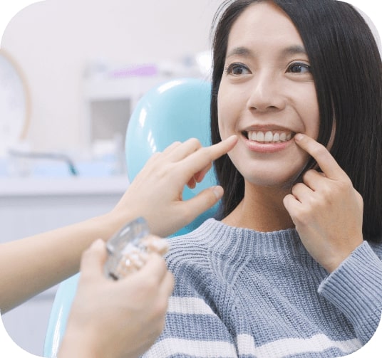 Smiling woman enjoying the benefits of dental implants