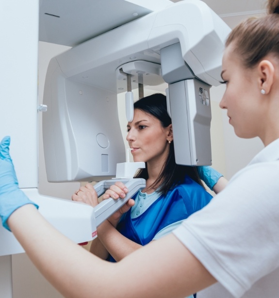 Woman receiving 3 D C T cone beam x ray scans