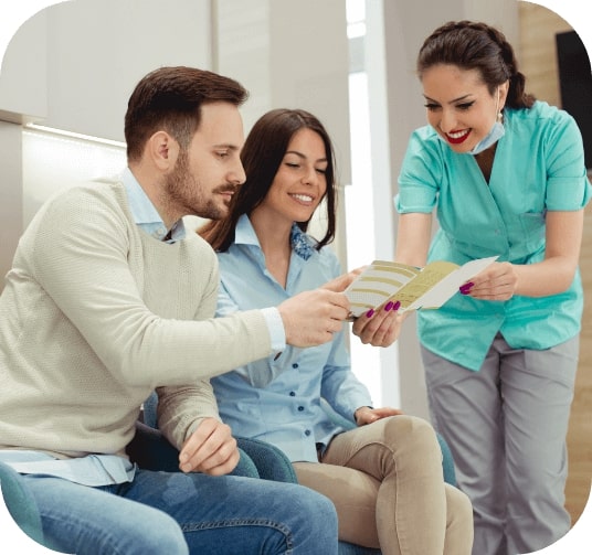 Dental team member explaining how dental insurance works